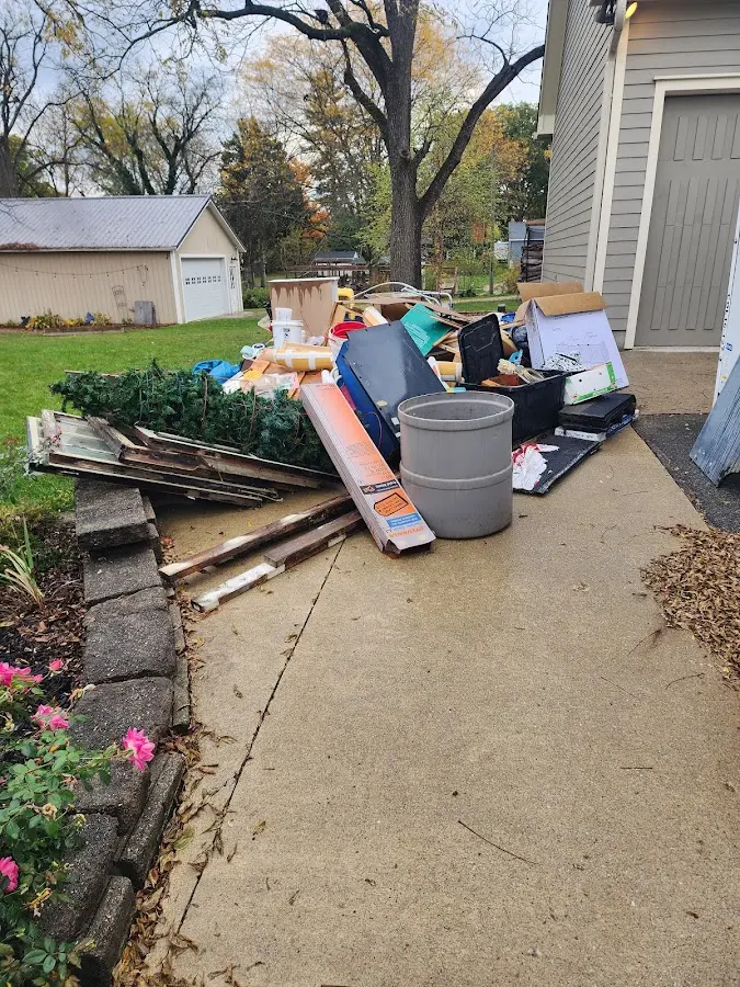 Dumpster being loaded with debris for Residential Dumpster Rental in Rapid Valley
